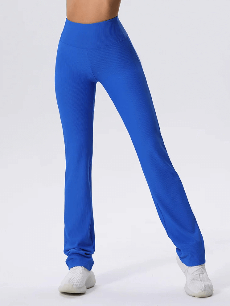 Vibrant blue ribbed yoga leggings, full-length with elastic waist, offering flexibility and style for active wear.